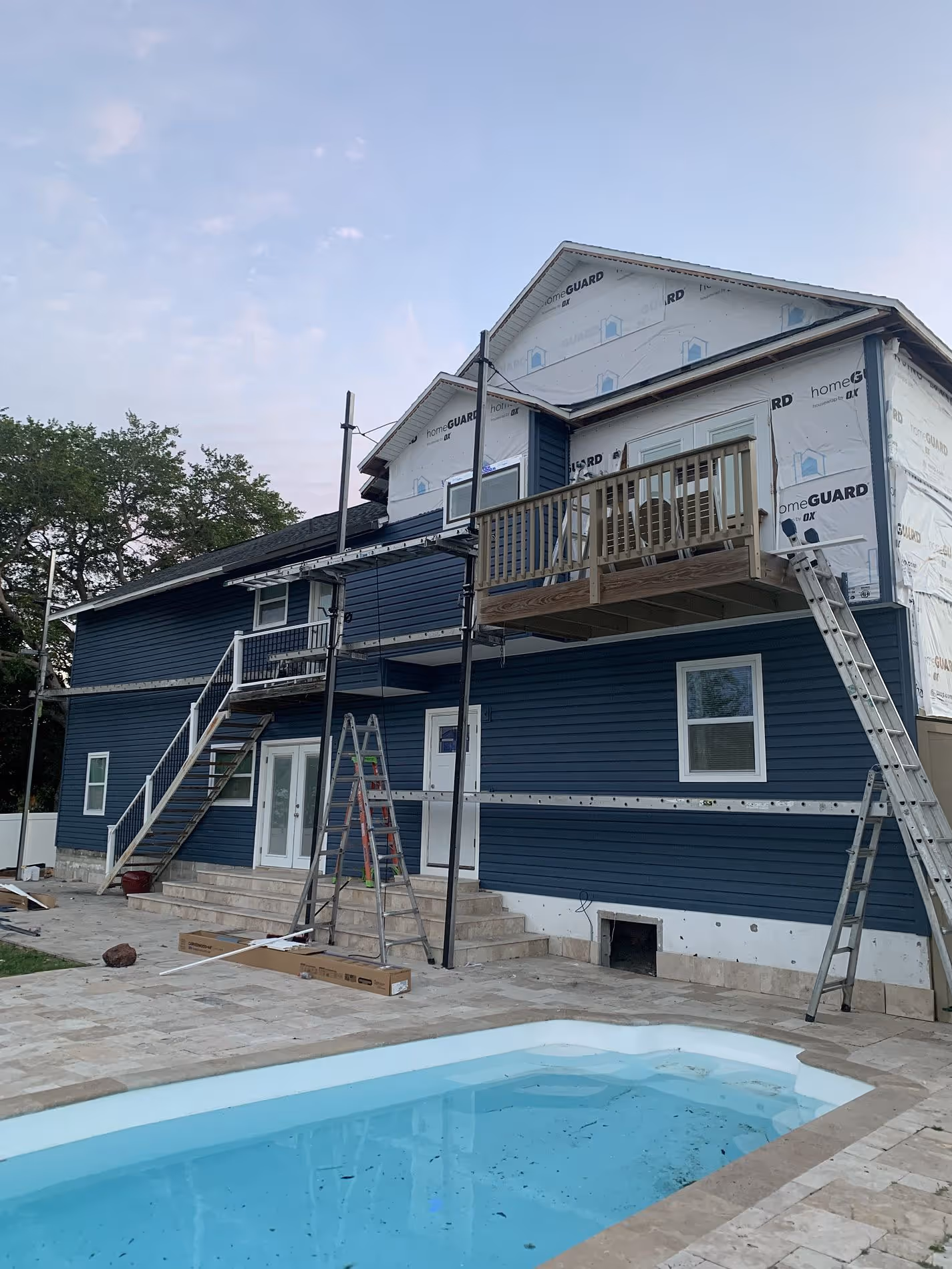 Siding installation in progress on Florida coastal home showing Mastic siding upgrade for long-term weather resistance